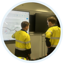Executives reviewing performance boards in an operations room