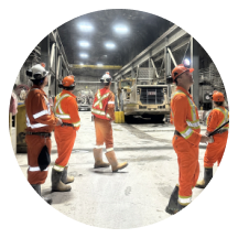 Contractor personnel in high-visibility workwear on site
