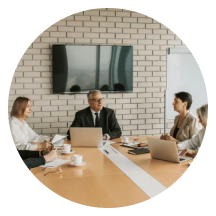 Project owners meeting around a boardroom table