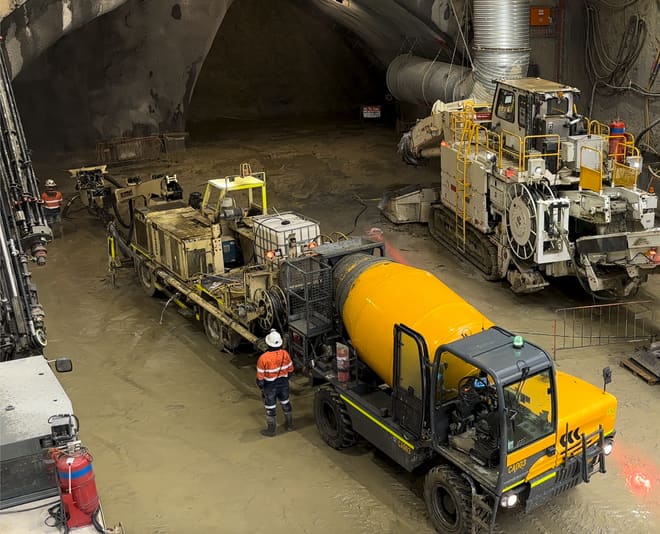 Site vehicles and machinery lined up inside a tunnel