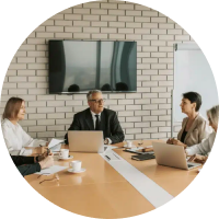 Leadership team meeting around a boardroom table